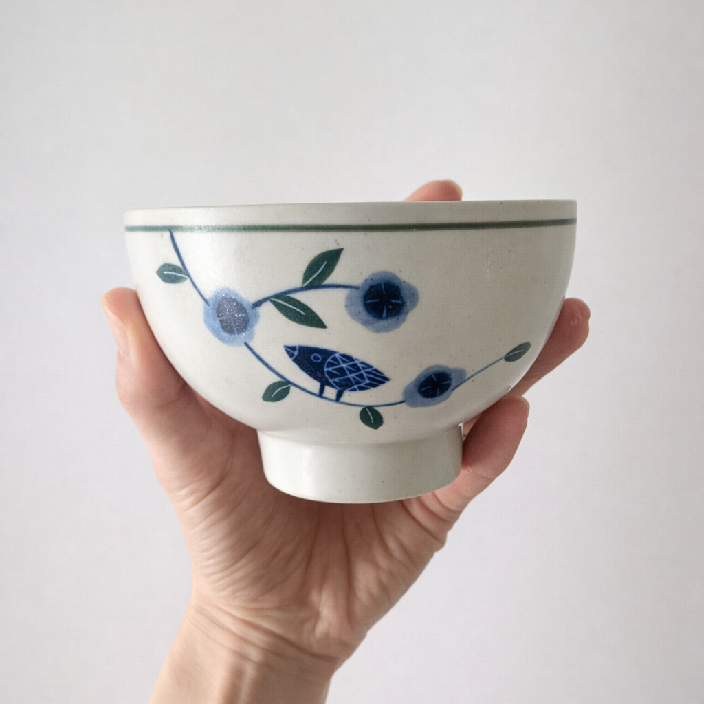Close-up of hand-drawn camellia pattern on Minhwa Korean ceramic bowl
